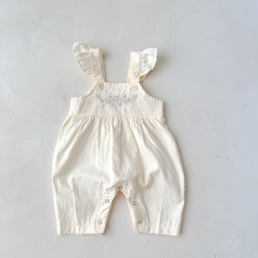 Apricot baby suspender romper laid flat, front side view – adjustable and breathable – beekaaboo.com