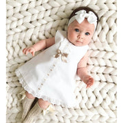 Complete look of BEE KAA BOO baby girls' dress with a matching bow headband, ideal for birthdays, weddings, and more. Visit beekaaboo.com for details.