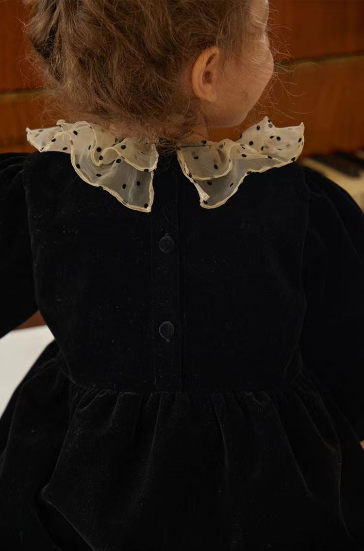 Close-up of the back buttons and polka dot ruffle collar on black velvet girl’s dress – beekaaboo.com
