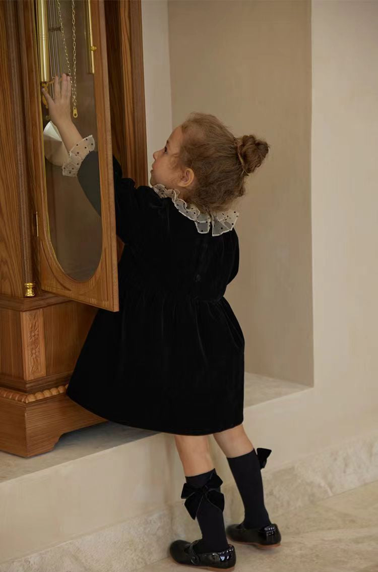 Back buttons and polka dot ruffle collar on black velvet girl’s dress – beekaaboo.com