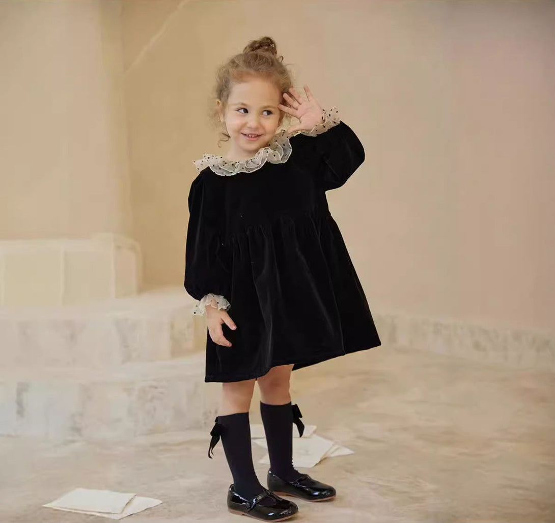 Smiling girl wearing black velvet long sleeve dress with polka dot collar – beekaaboo.com