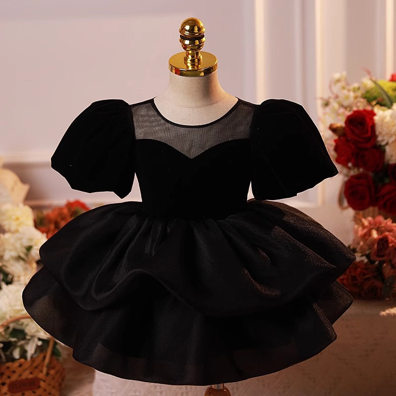 Front view of elegant black puff sleeve princess dress with layered skirt – perfect for parties and weddings – beekaaboo.com