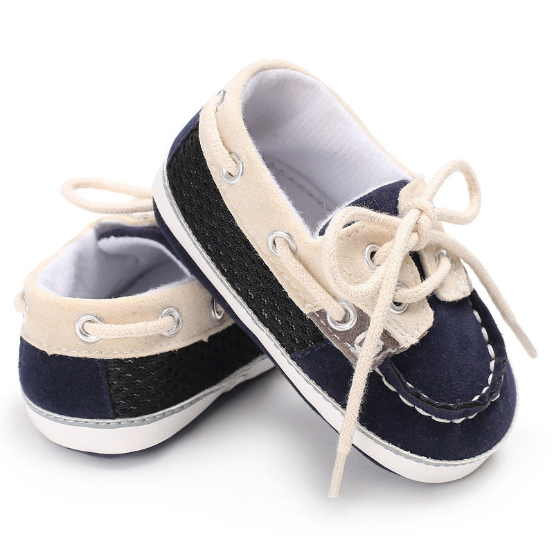 Blue soft-bottom baby shoes made of breathable mesh, designed for crawling, cruising, and early walking. Shop this comfy baby essential at beekaaboo.com.