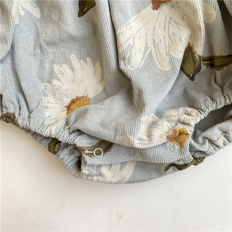 Close-up detail of corduroy fabric and stitching on baby girl romper – beekaaboo.com