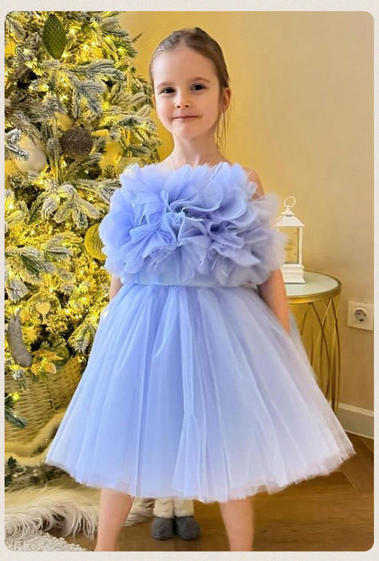 Girl wearing blue puffy princess dress standing beside Christmas tree – perfect for weddings and parties – beekaaboo.com