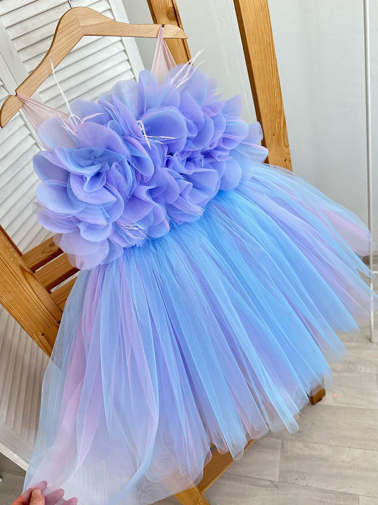 Girl wearing blue puffy princess dress standing beside Christmas tree – perfect for weddings and parties – beekaaboo.com
