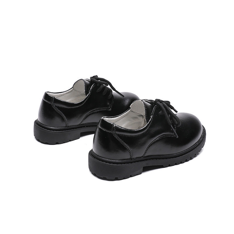 Alternate side view showing the sleek design and durable leather of these black children's shoes – beekaaboo.com