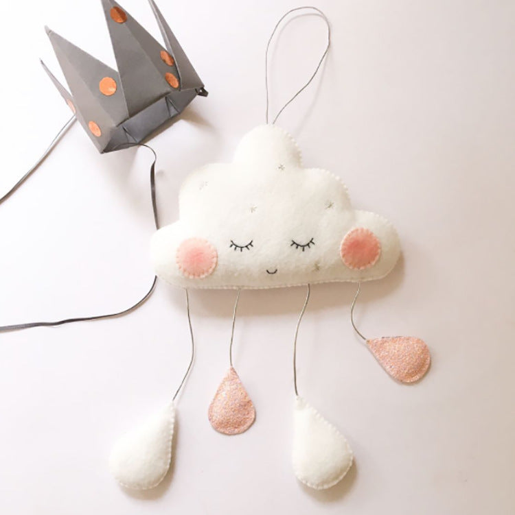White cloud-shaped felt ornaments in grey, pink, and white with dangling raindrops – soft and decorative – beekaaboo.com