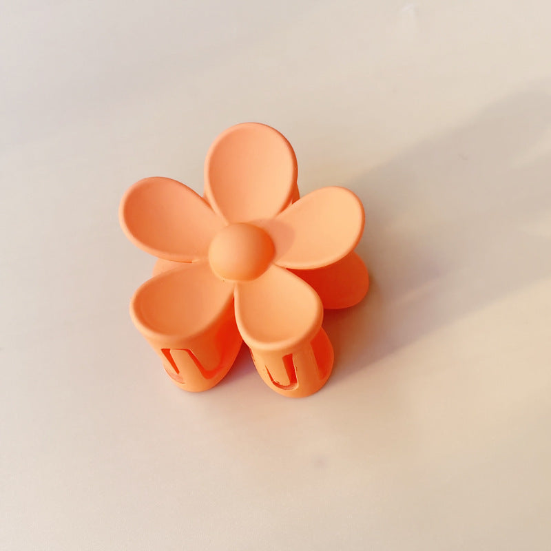 Matte frosted flower hair clip in Orange Small – soft resin claw clip for girls and women – beekaaboo.com