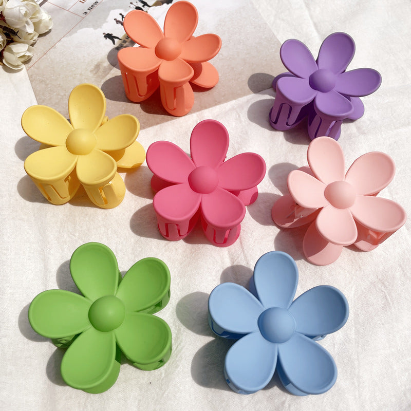 Display of all 30+ color variations of frosted flower hair clips in small and big sizes – soft matte finish – beekaaboo.com