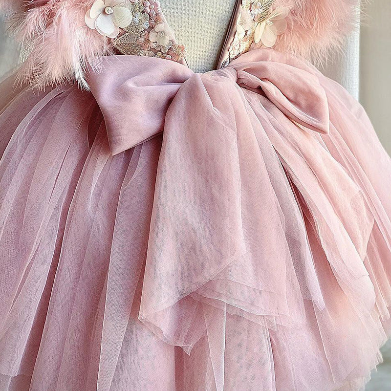Back view of pink princess dress with oversized bow and layered tulle skirt – beekaaboo.com
