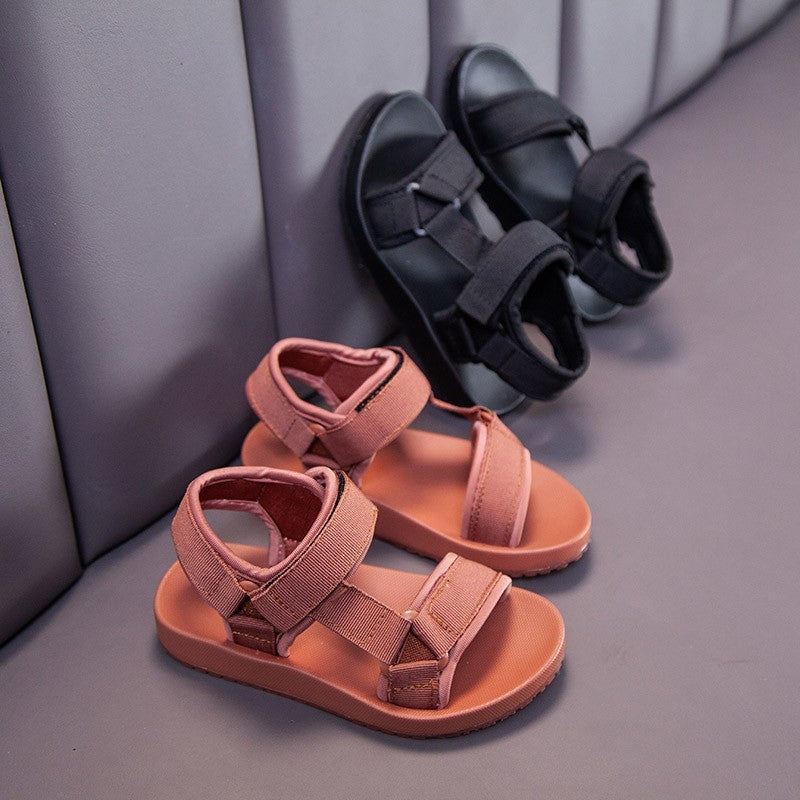 Side view of PU leather kids sandals in black and chocolate brown – breathable and slip-resistant – beekaaboo.com