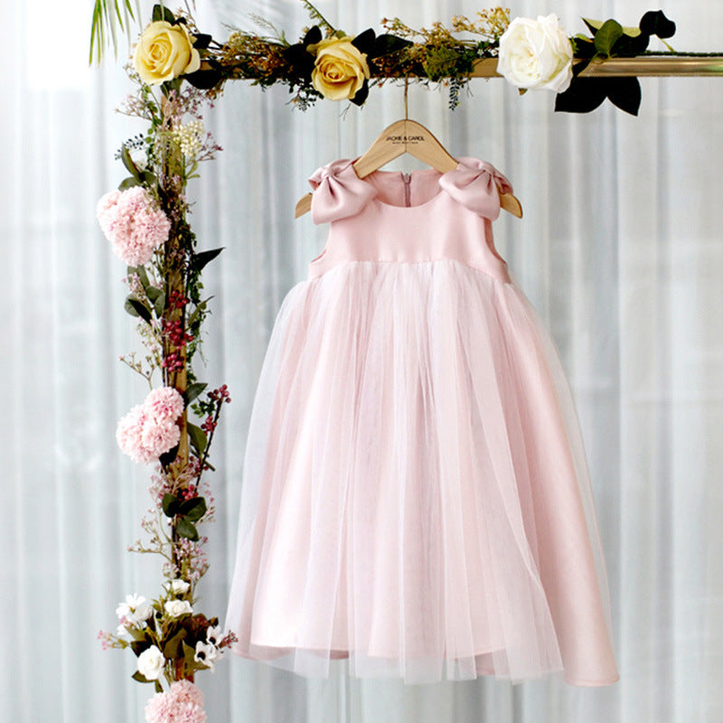 Baby girl pink princess dress with bow shoulders and layered puffy tulle skirt – front view – beekaaboo.com