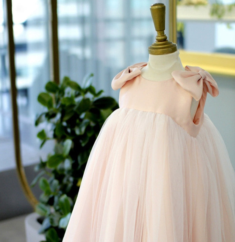 Baby girl pink princess dress with bow shoulders and layered tulle skirt displayed on mannequin – beekaaboo.com