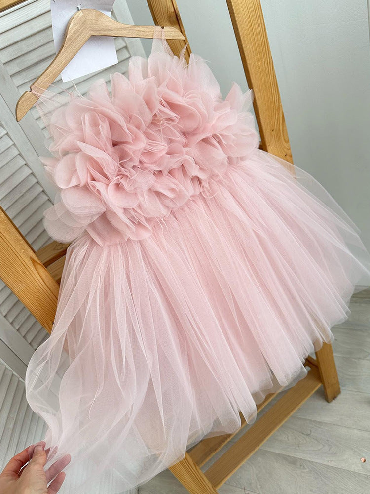 Close-up of pink puffy princess dress with oversized floral detailing on chest – beekaaboo.com