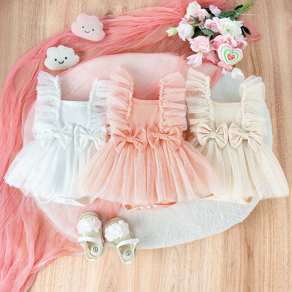 Display of apricot, white, and pink net skirt baby jumpsuits – sleeveless and elegant – beekaaboo.com