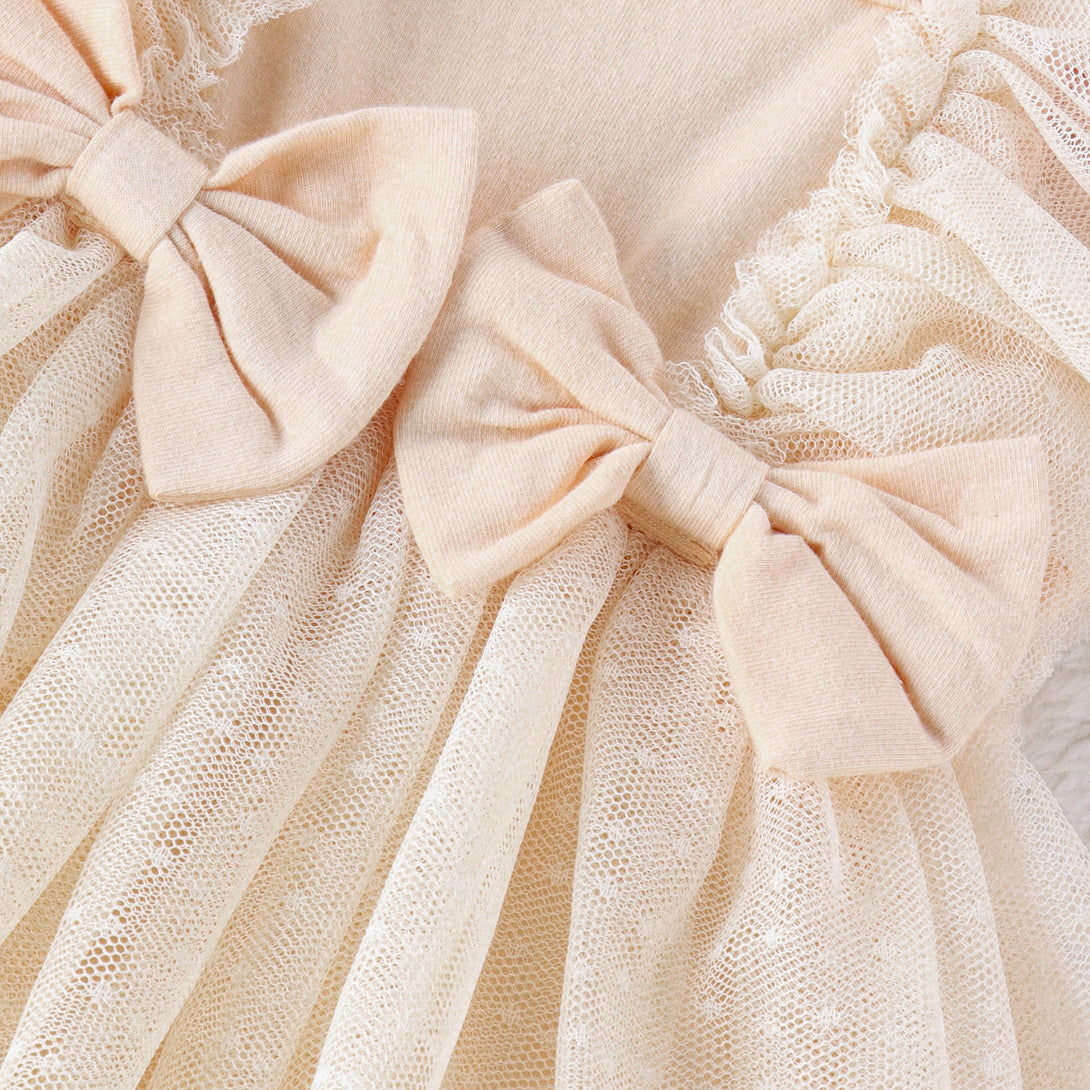 Close-up of ruffled net skirt on baby jumpsuit showing fabric texture and finish – beekaaboo.com