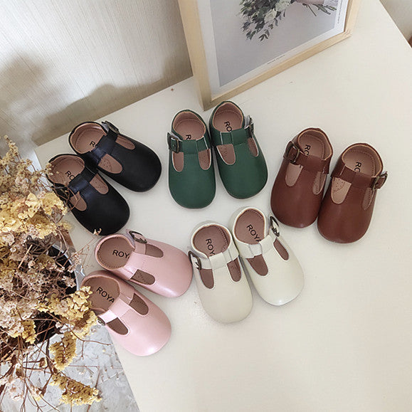 High-top princess-style baby shoes in black, brown, pink, and white colors displayed together. Elegant soft-soled toddler shoes – beekaaboo.com.