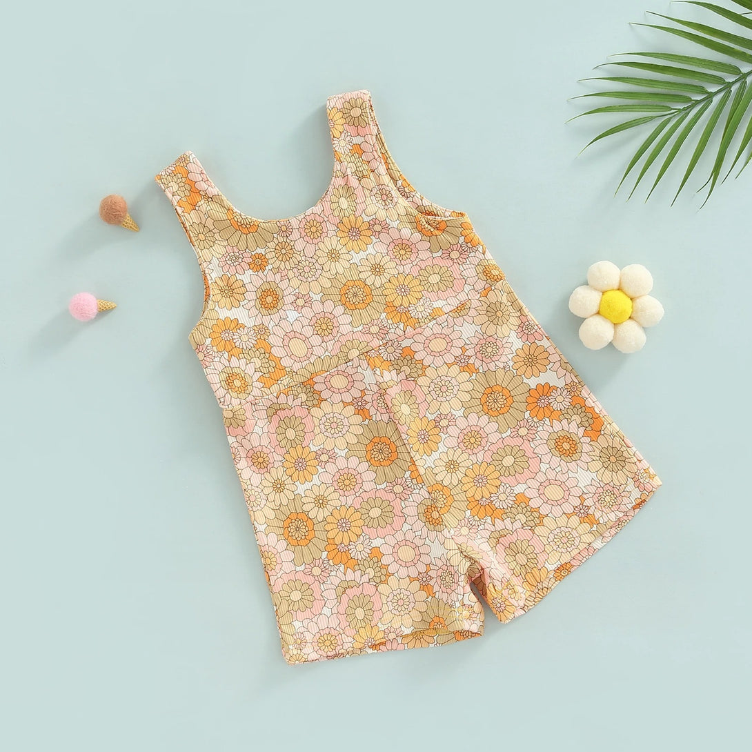 Flat lay of Orange ribbed baby romper with floral detail and zipper – soft and breathable – beekaaboo.com