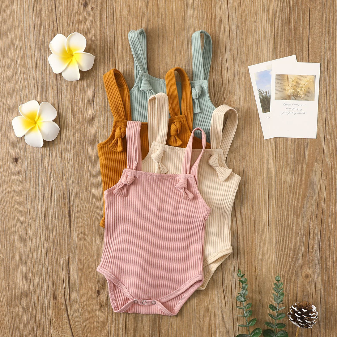 Display of all four color variations of sleeveless cotton baby romper – pink, beige, brown, and light green – beekaaboo.com