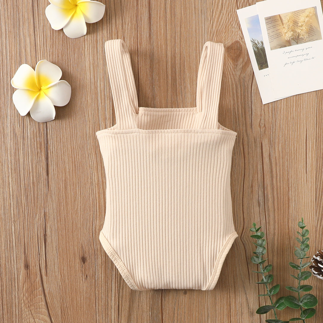 Back view of beige summer cotton baby romper with sleeveless strap design – beekaaboo.com
