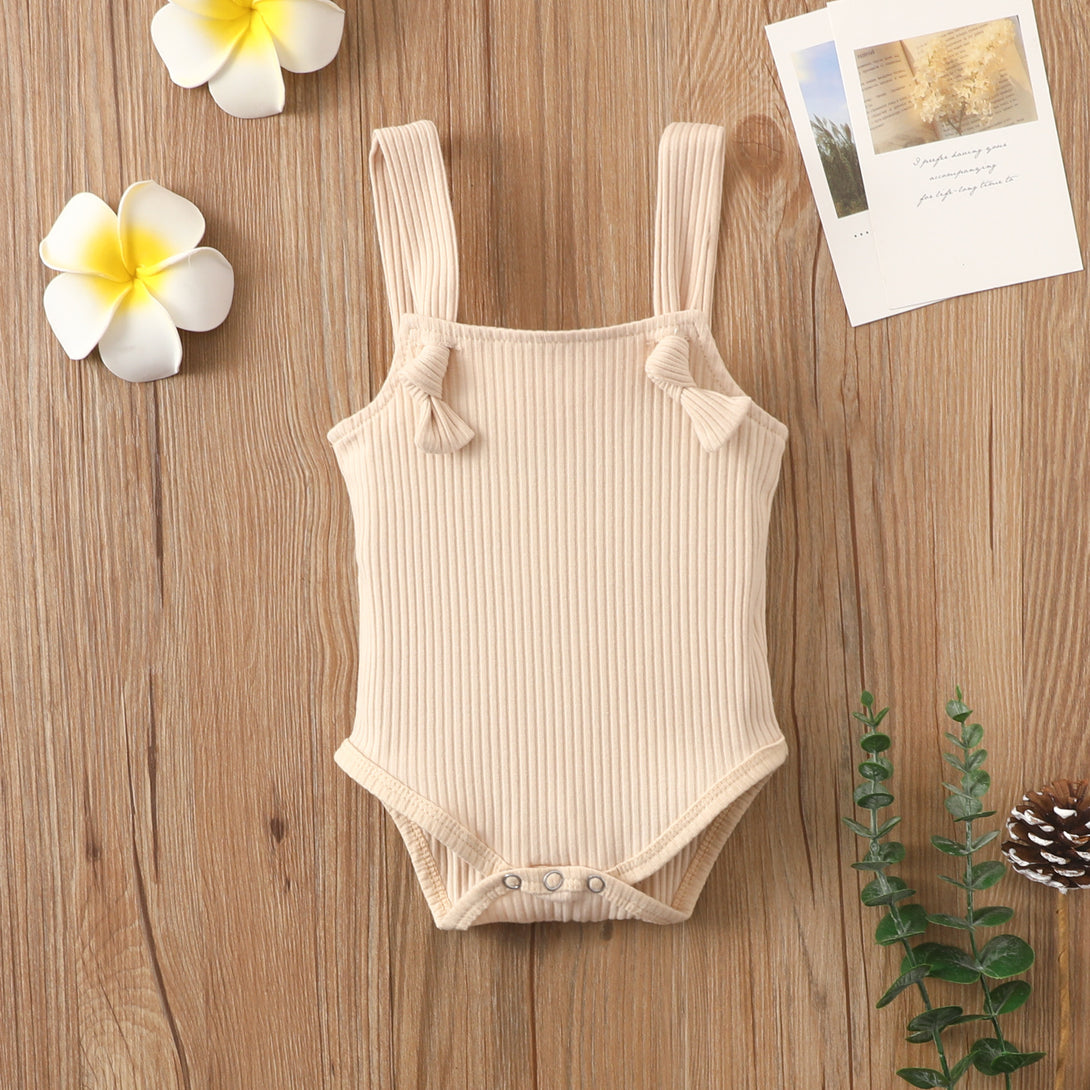Front view of beige summer cotton baby romper with sleeveless strap design – beekaaboo.com