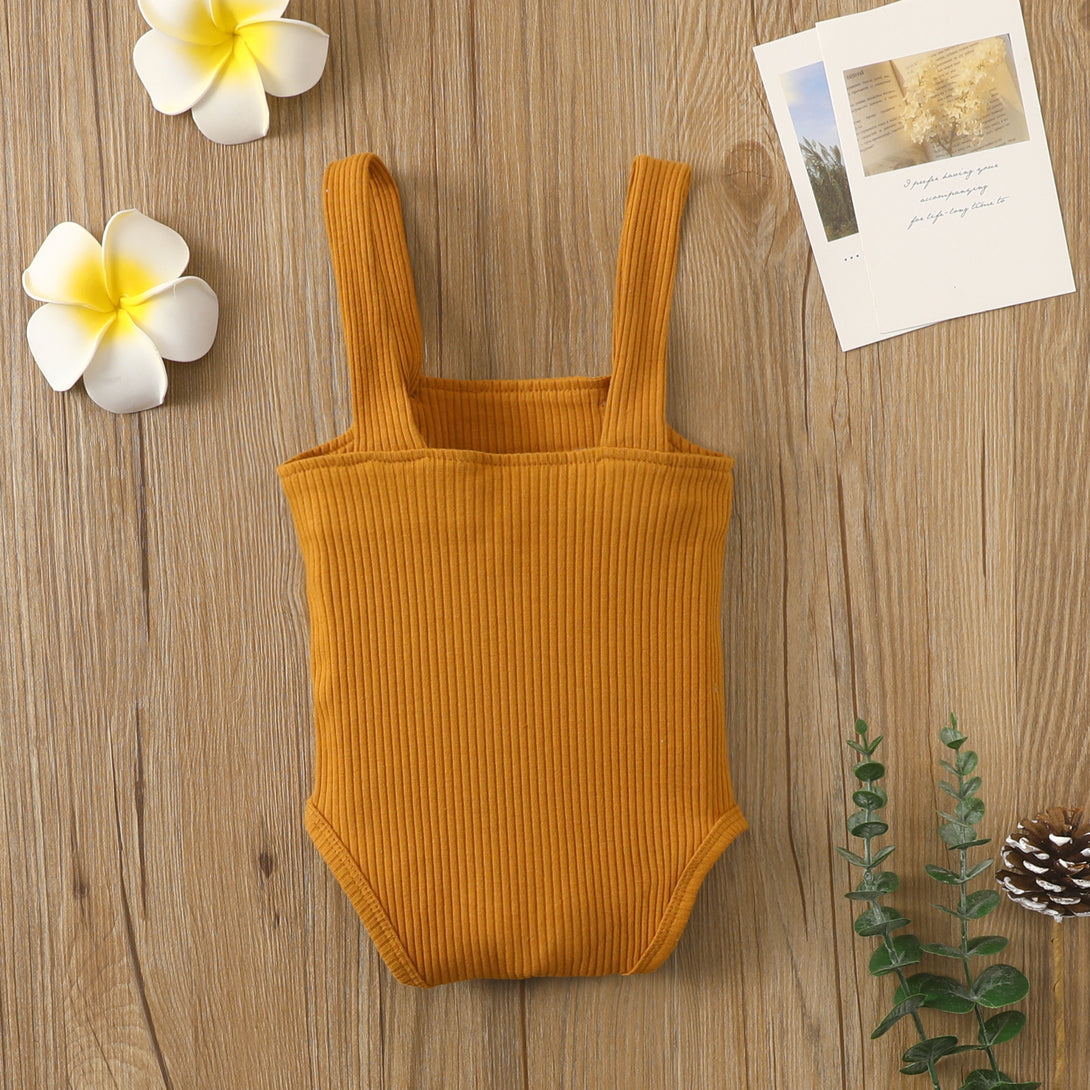 Back view of brown cotton romper with hollow stripes and soft texture – beekaaboo.com