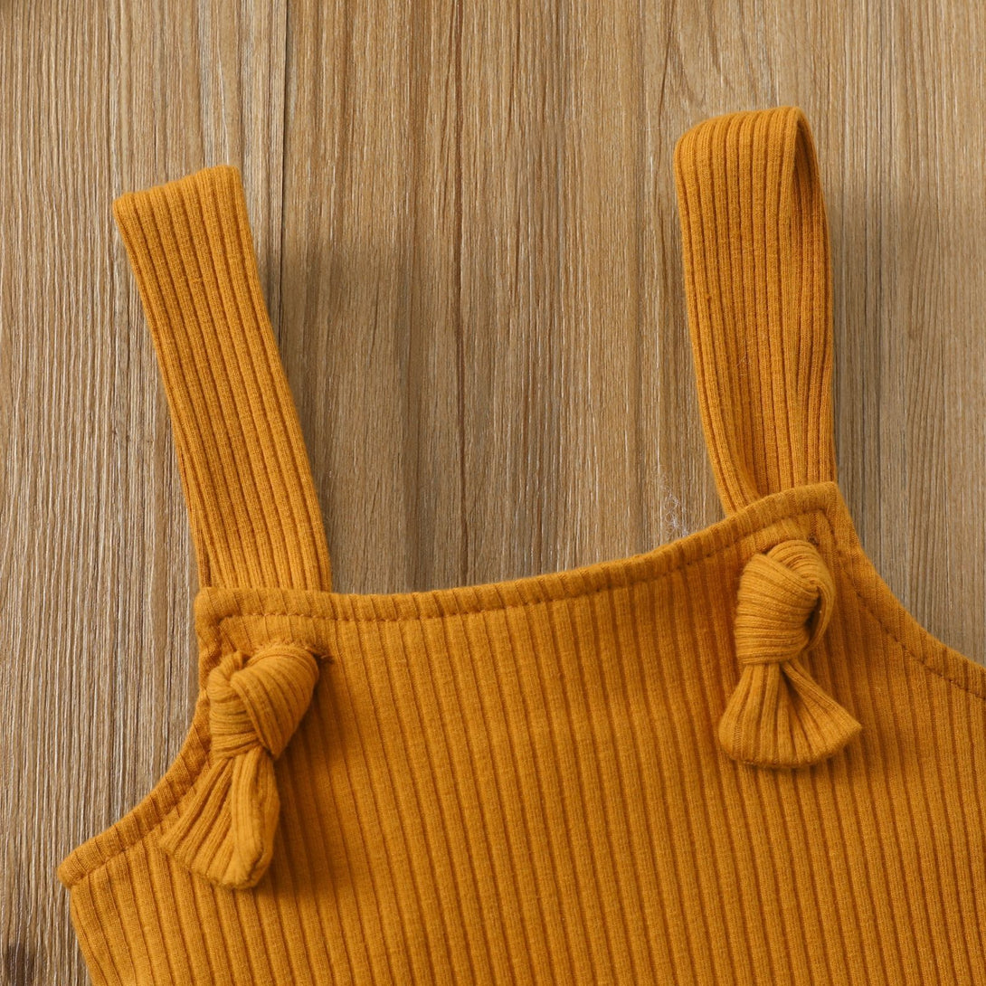 Brown sleeveless baby romper styled flat with soft cotton fabric and hidden closure – beekaaboo.com
