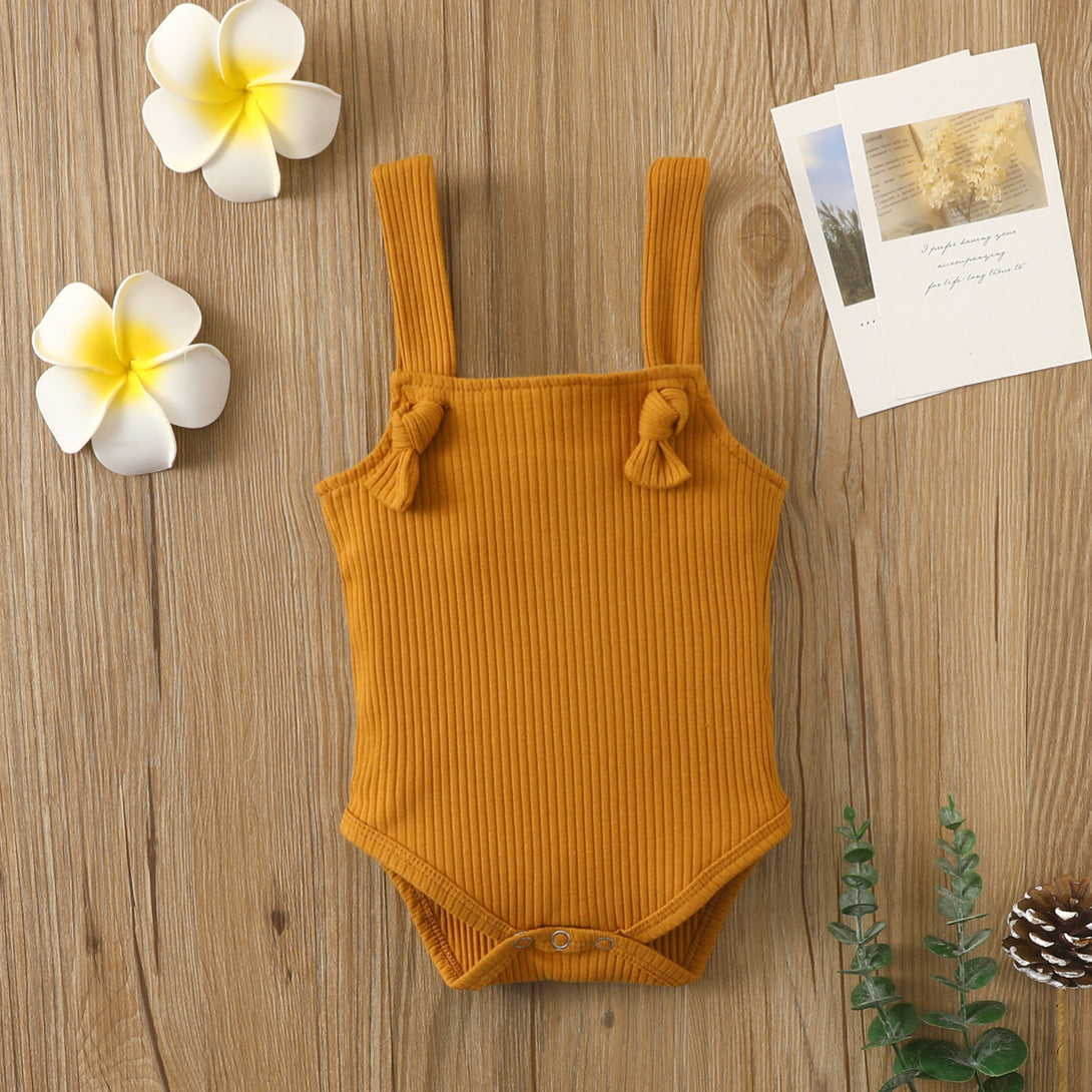 Brown sleeveless baby romper styled flat with soft cotton fabric and hidden closure – beekaaboo.com
