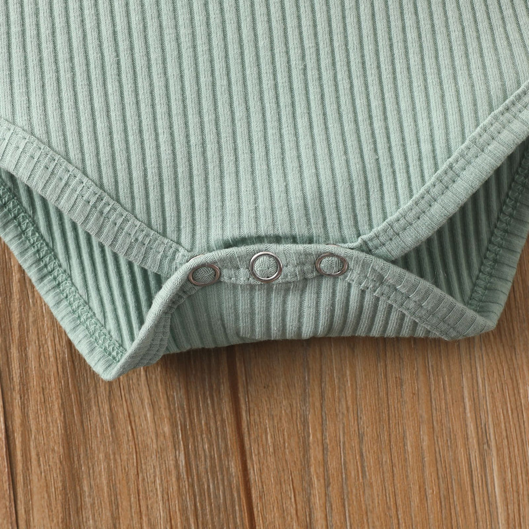 Light Green sleeveless baby romper styled flat with soft cotton fabric and hidden closure – beekaaboo.com