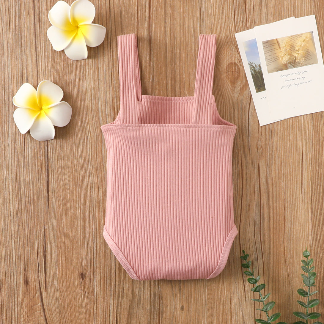 Back view of pink cotton romper with hollow stripes and soft texture – beekaaboo.com