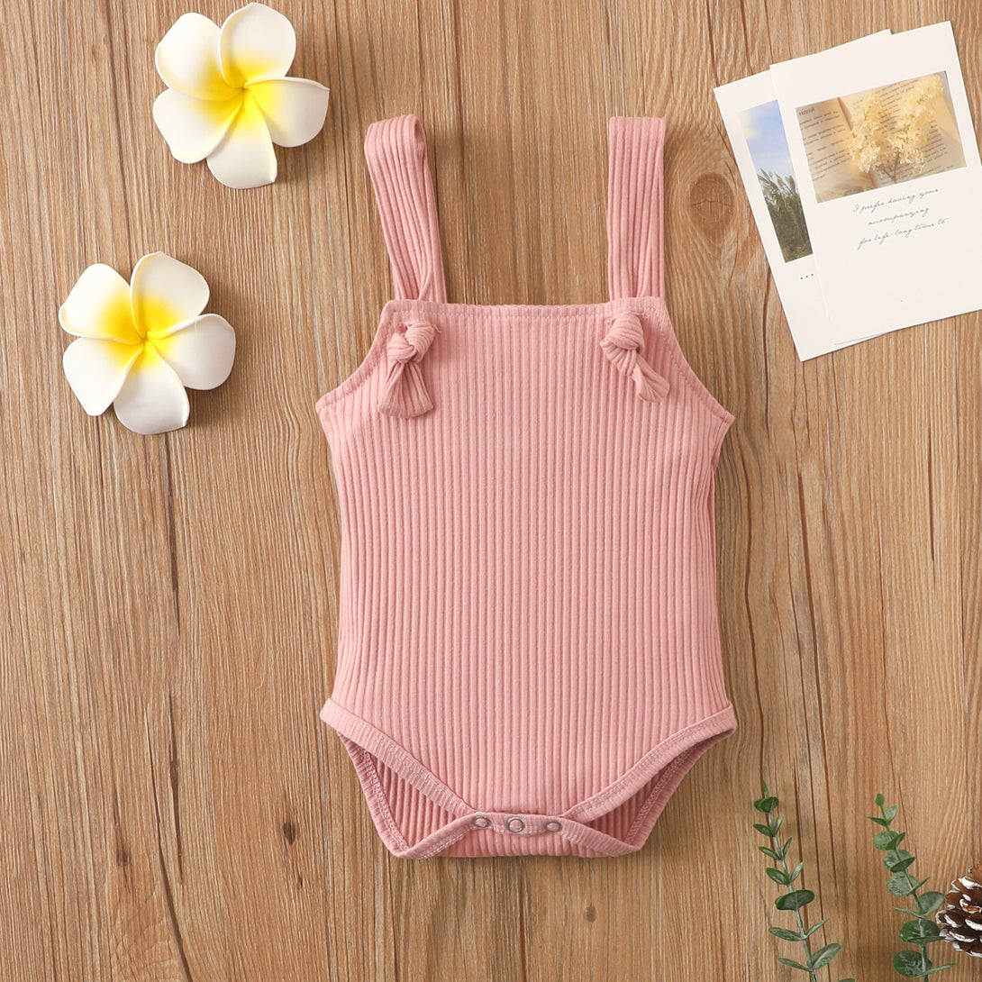 Front view of pink cotton baby romper with straps – breathable summer outfit – beekaaboo.com