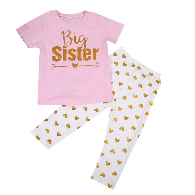 oddler girl outfit with pink Big Sister T-shirt and white pants with golden heart print – beekaaboo.com