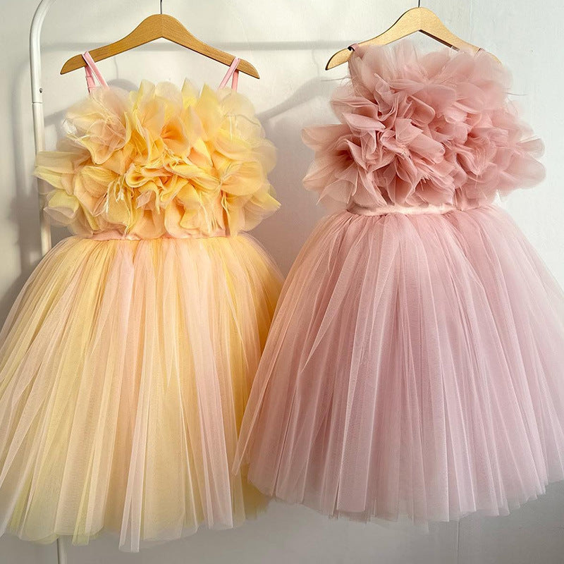 Elegant wedding children’s princess dresses in white, pink, rose red, blue, and light blue hanging on a rack – beekaaboo.com