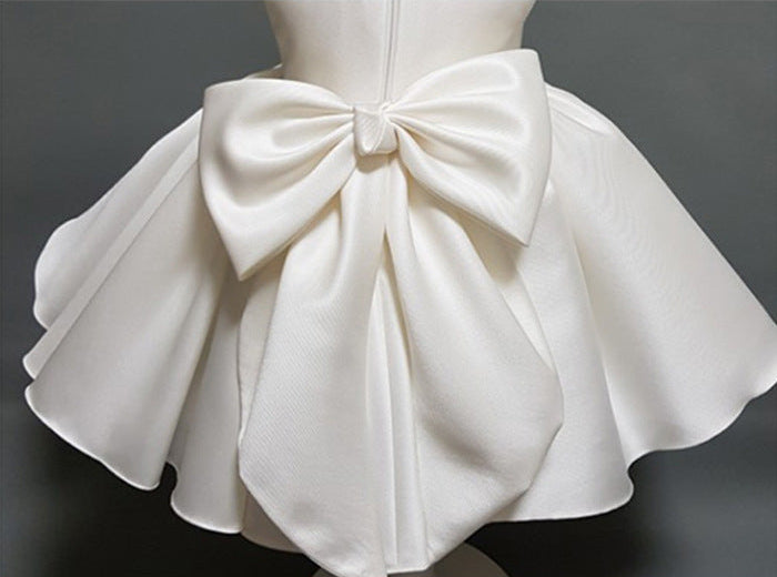 Back view showing bow detail of white princess party dress – beekaaboo.com