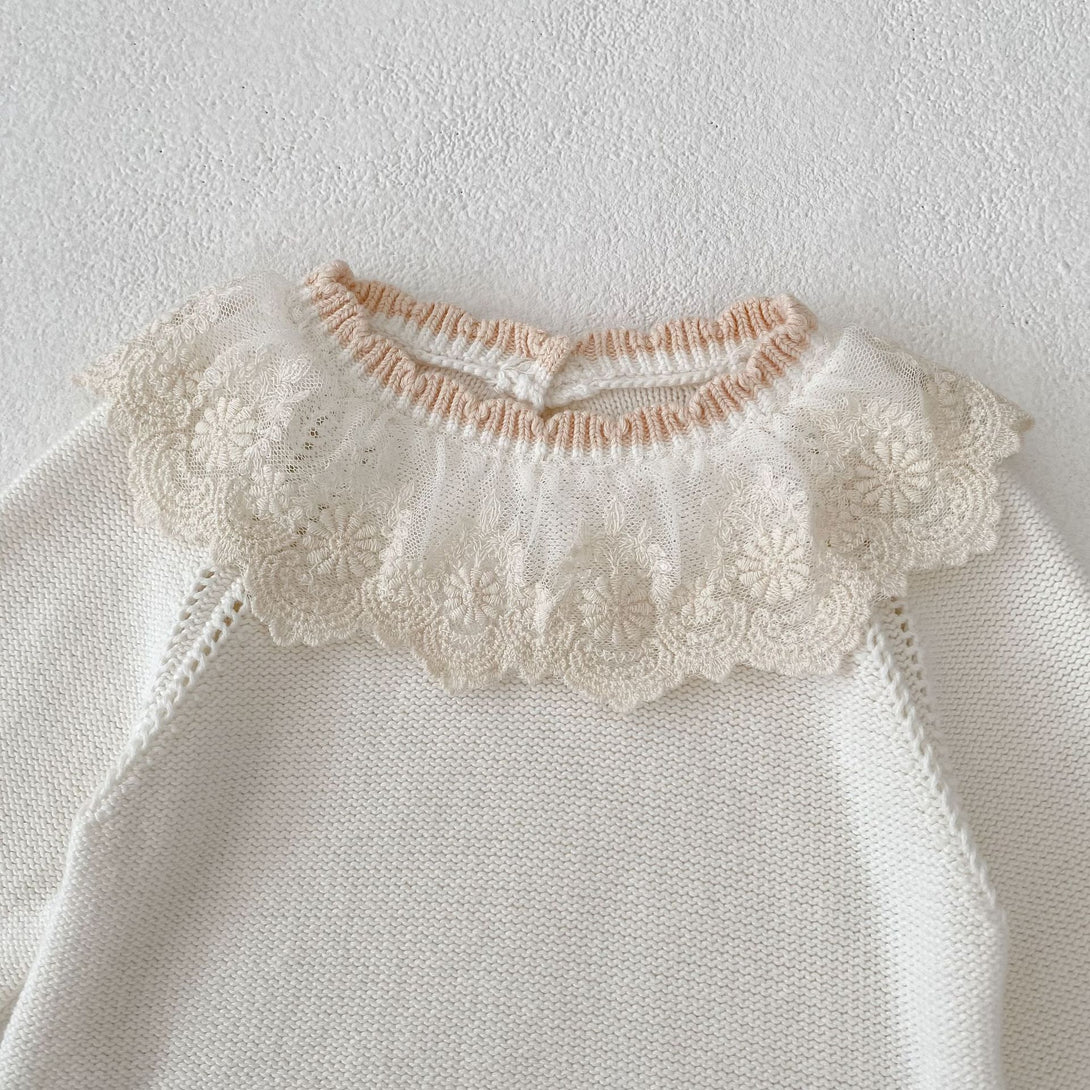Lace collar close-up detail of baby knitted romper | beekaaboo.com