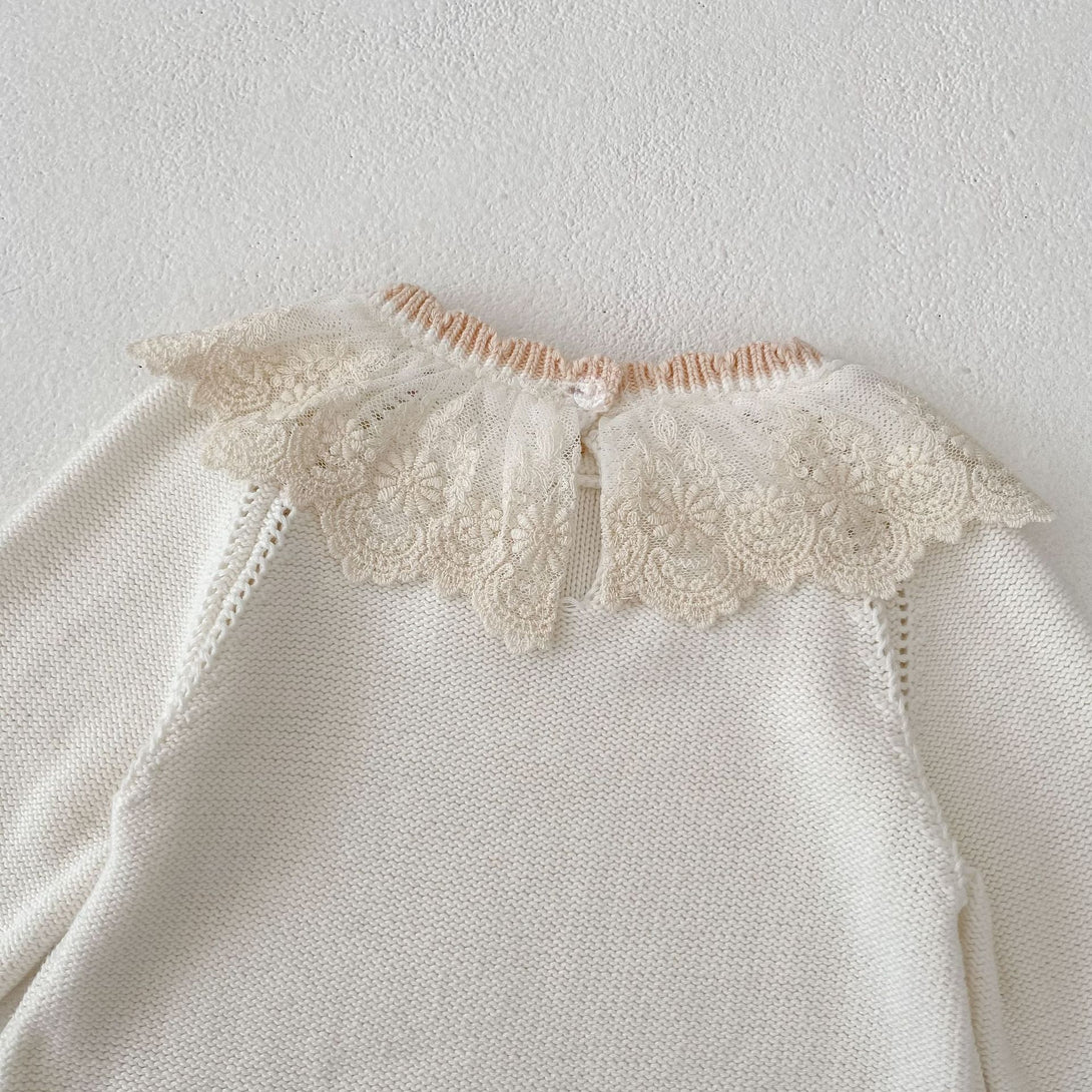 Lace collar close-up detail of baby knitted romper - back view| beekaaboo.com