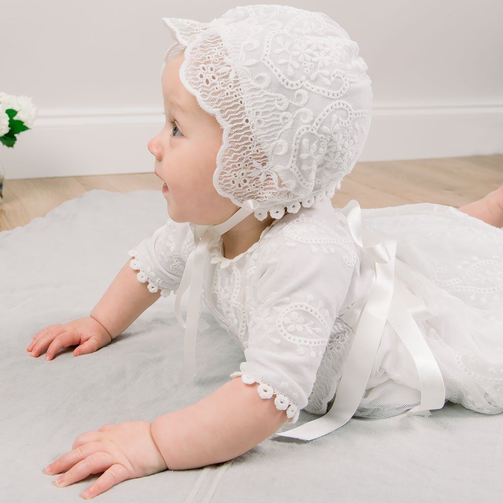 Side angle view of baby in elegant long sleeve baptism outfit with bonnet – beekaaboo.com