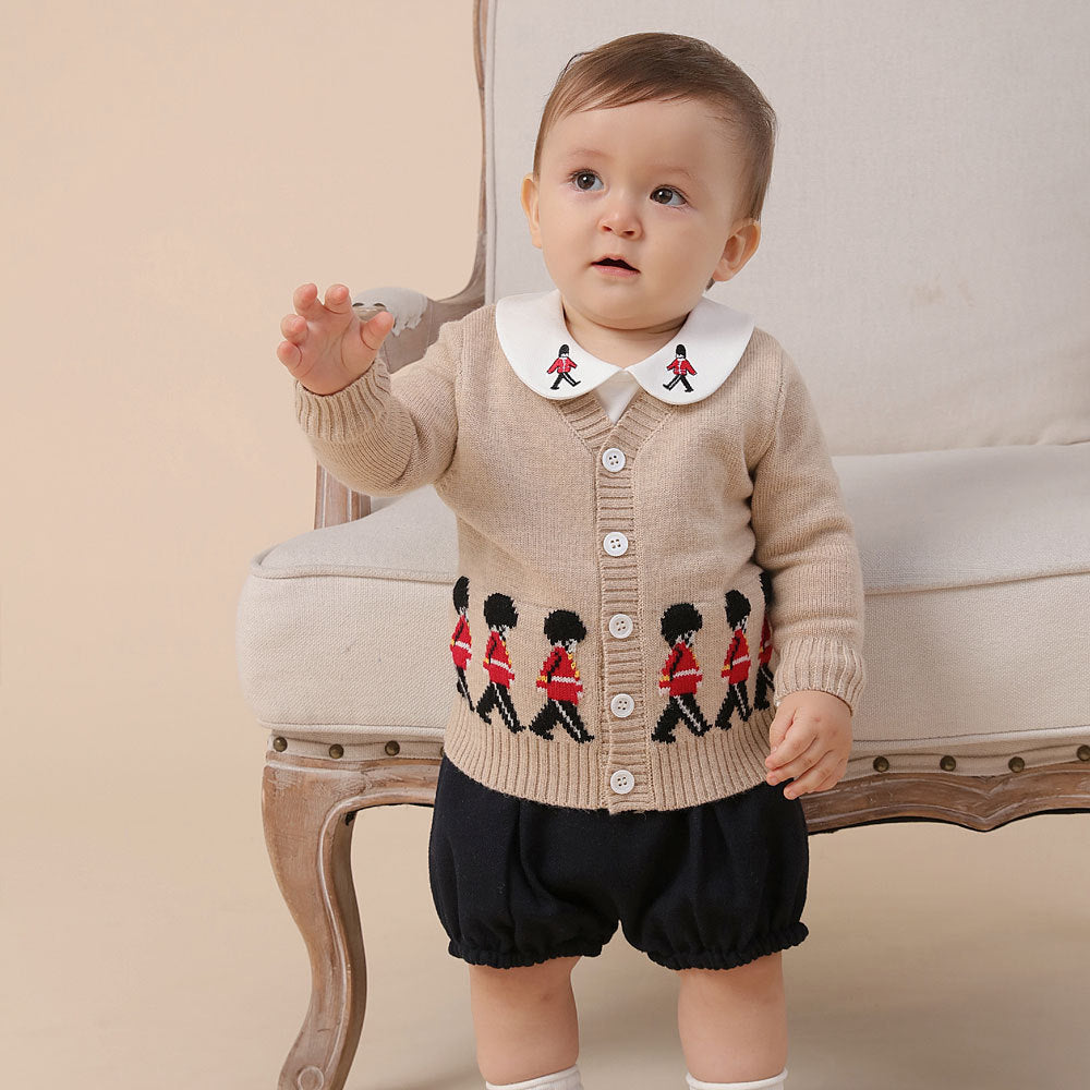 Toddler smiling in knitted cardigan outfit – BeeKaaBoo.com