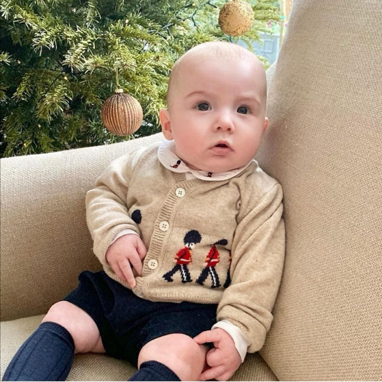 Sitting baby in beige cardigan and navy shorts – BeeKaaBoo.com