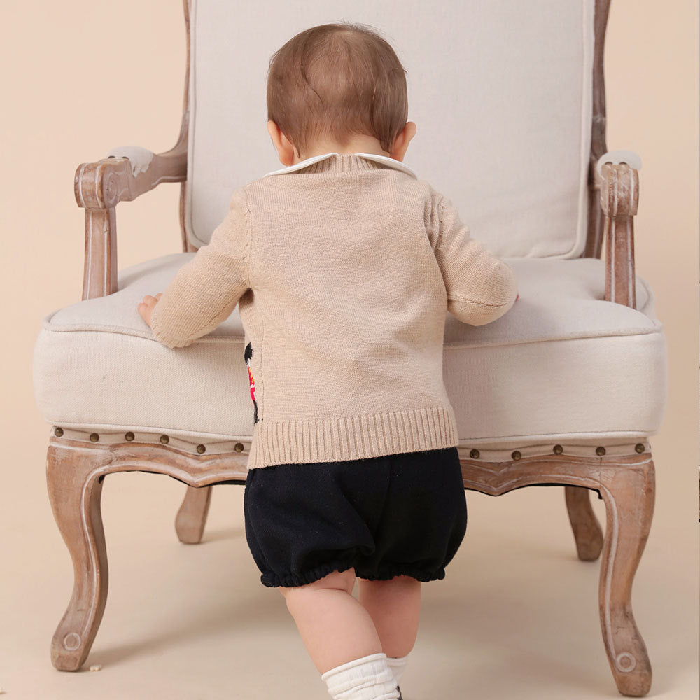 Baby wearing beige cardigan with red guard embroidery – BeeKaaBoo.com