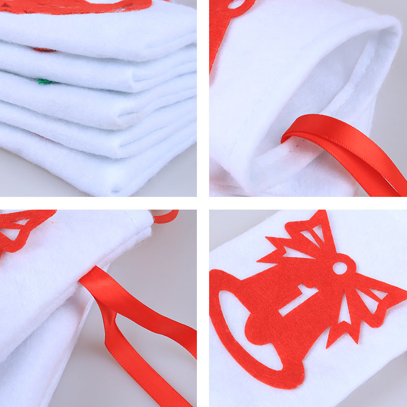 Close-up of red ribbons and felt numbers on holiday countdown bags – beekaaboo.com