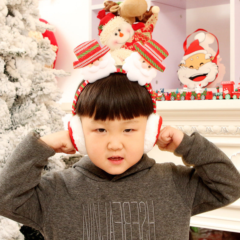 Boy posing with Santa Christmas Earmuffs – Holiday Fun – beekaaboo.com