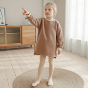 Girl wearing thermal footed tights styled with dress – beekaaboo.com