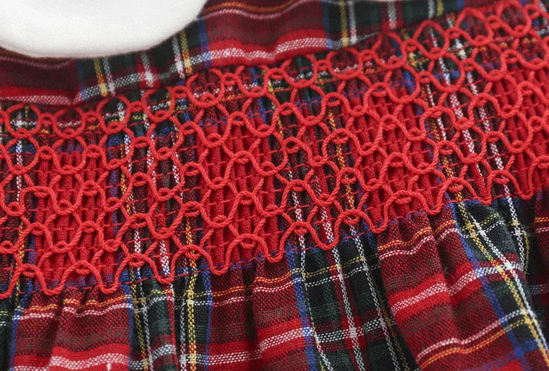 Close-up smocking detail on red plaid baby dress – beekaaboo.com